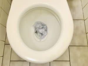 Clogged toilet with paper
