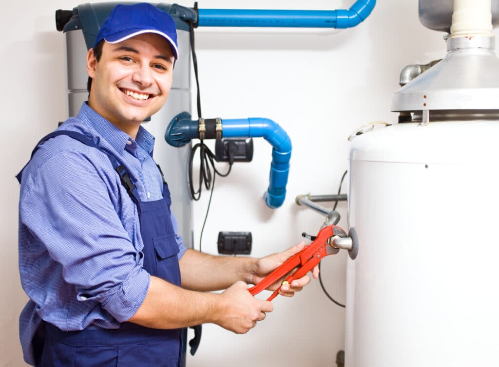 technician repairing hot-water heater